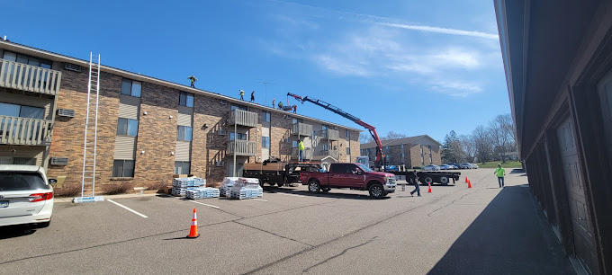 A red truck is parked in a parking lot